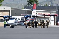 N49JS @ KBOI - Smoke jumpers boarding for practice jump on NIFC ramp. - by Gerald Howard