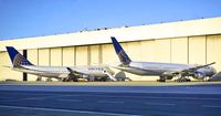 N128UA @ SFO - 747-400 next to its new replacement, 777-300er. SFO. 2017. - by Clayton Eddy