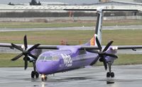G-JECY @ EGAC - Belfast City.  Flybe G-JECY – a wet departure to Birmingham. - by Albert Bridge