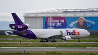 N585FE @ KOAK - Landing runway 28R North Field Oakland Airport. - by Clayton Eddy