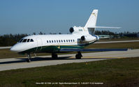N111MU @ APF - Falcon 900 taxiing to take off. - by J.G. Handelman