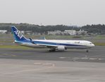 JA620A @ RJAA - Taxying for departure - by Keith Sowter