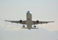 G-TCDC @ LOWI - Rocketing out of LOWI, Innsbruck with the austrian alps in the background - by Paul H