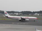 B-6097 @ NRT - Taxying for departure - by Keith Sowter