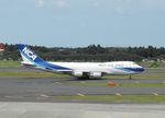 JA08KZ @ RJAA - Taxying for departure - by Keith Sowter