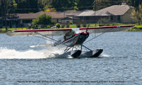 N9493D @ F57 - Taxiing to shore.