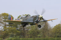 G-CICK @ EGKH - Supermarine 361 Spitfire LF.IXe, previously NH341 coded DBE. Shot down by FW190s 22 June 1944 South East of Caen France, 2 July 1944 displayed as DBO at the Bayeux Memorial Museum France, registered to UK owner June 2014. Seen departing runway 10.
