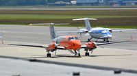 D-CFMD @ LOWG - Beech 300 King Air at LOWG with a Piaggio P.180 in the background - by Paul H