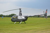 OE-XMO @ EGTB - Robinson R44 Raven II at Wycombe Air Park. - by moxy