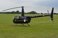 G-IBMS @ EGTB - Robinson R44 Raven II at Wycombe Air Park. - by moxy