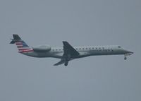 N674RJ @ KDFW - At DFW. After a 45 minute hold because of severe storms, starting to land in heavy rain. - by paulp