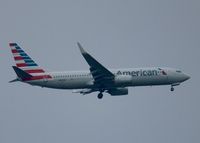 N889NN @ KDFW - At DFW. After a 45 minute hold because of severe storms, starting to land in heavy rain. - by paulp