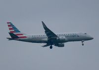 N231AN @ KDFW - At DFW. After a 45 minute hold because of severe storms, starting to land in heavy rain. - by paulp