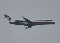N879AS @ KDFW - At DFW. After a 45 minute hold because of severe storms, starting to land in heavy rain. - by paulp