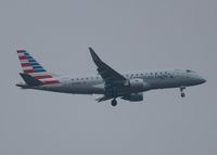 N243NN @ KDFW - At DFW. After a 45 minute hold because of severe storms, starting to land in heavy rain. - by paulp
