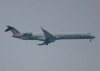 N938LR @ KDFW - At DFW. After a 45 minute hold because of severe storms, starting to land in heavy rain. - by paulp