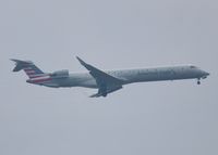 N329MS @ KDFW - At DFW. After a 45 minute hold because of severe storms, starting to land in heavy rain. - by paulp