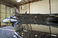N81827 @ KBOI - In for maintenance. Beautiful gloss black paint. - by Gerald Howard