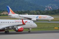 SU-TMH @ LOWG - SkyEgypt B737 (SU-TMH) with an Austrian Airlines ERJ-195 (OE-LWJ) - by Paul H