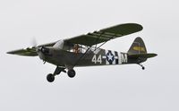G-AKIB @ EGFP - Visiting Piper Grasshopper in 1944 US Army markings of aircraft 480015/44-M. Low passover Runway 22. - by Roger Winser