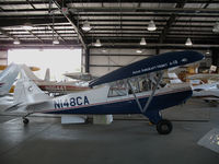 N148CA @ O22 - Locally-based 2005 Aviat A-1B Husky in hangar @ Columbia, CA (now relocated to Krugersdorp Airfield (FAKR) South Africa and still registered as N148CA to International air Services, Inc, Nelspruit Mpumala!) - by Steve Nation