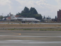 N51VL @ KHWD - Locally-based SP Aviation 1999 Gates Learjet 55 rolling for takeoff @ Hayward Executive Airport, CA (re-registered N801GJ same owner in 2011 and active) - by Steve Nation