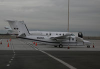 N50DX @ KOAK - 1974 Aero Commander 690A with windshield cover @ Oakland International Airport, CA North Field - by Steve Nation