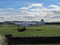 ZK-WAE @ NZAR - on grass parking by cafe - by magnaman
