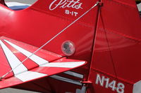N148 @ SZP - 1983 Aerotek PITTS S-1T SPECIAL, Lycoming AEIO-360 180 Hp, 4 ailerons, closeup of clear circular covers that allow direct easy preflight check of the all-important elevator linkage for integrity. - by Doug Robertson