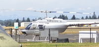 N911A @ OLM - A visitor from the State of Arkansaw Bell OH-58A N911A.  72-21424 at Northwest Helicopters, Olympia WA, USA an belonging to the CITY OF LITTLE ROCK - by RAFOHunter
