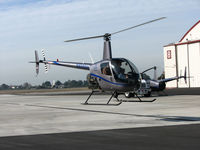 N828SH @ KOAK - Silver State Helicopters 2005 Robinson R22 BETA in hover @ Oakland International Airport, CA North ramp (to Humbird Helicopters 2009-08-07) - by Steve Nation