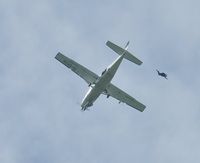 G-SYLV @ EGFH - Geronimo! Skydiver exits Skydive Swansea's Grand Caravan. - by Roger Winser
