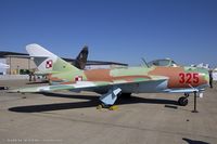 1F0325 @ KOQU - PZL Mielec Lim-6bis (MiG-17)  C/N 1F0325  is a license built version known as a Lim-6bis.The QAM's MiG (1FO325) is one of 25 that was purchased by Dave Tallichet directly from the Polish Air Force, and donated to QAM.