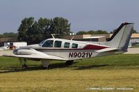 N9021V @ KOSH - Beech 58 Baron  C/N TH-233, N9021V - by Dariusz Jezewski www.FotoDj.com