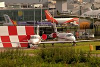 CS-DXF @ EGCC - two corp jets parked up on the [FBO exc ramp] CS-DXF is to the right of shot. - by andysantini