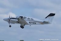 N2110A @ KOSH - Beech 58P Baron  C/N TJ-129, N2110A - by Dariusz Jezewski www.FotoDj.com