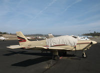 N8321M @ KAUN - Locally-based 1980 PA-28-181 Cherokee under cover @ Auburn Municipal Airport, CA - by Steve Nation