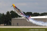 N669RB @ KOSH - Red Bull Air Race pilot, Kirby Chambliss take off, N669RB