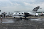 N951CM @ OSH - 2010 Cessna 510 Citation Mustang, c/n: 510-0327, note customer service greeter - by Timothy Aanerud