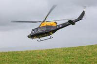 ZJ236 - Mid Wales training flight, on a peak 900ft usl, in the rain and wind, o what fun. One of the last flights this year by a Griffin.