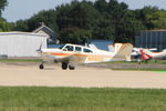 N990Q @ OSH - 1961 Beech P35, c/n: D-6856 - by Timothy Aanerud