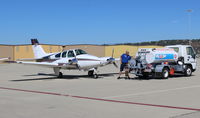 N550JA @ CMA - 1962 Beech 95-A55 BARON, two Continental IO-470 260 Hp each, fueling - by Doug Robertson