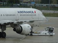 F-GMZD @ LFPG - AF pushback at CDG T2 with TPX100E - by JC Ravon - FRENCHSKY