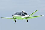 N9943H @ KOSH - Green reflects from the landing marks as this Cirrus SF50 Vision prepares to land at Oshkosh - by Terry Fletcher