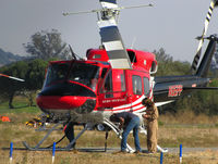 N85PP @ O69 - Pilot with Aero Tech LLC (Clovis, NM) 1985 Bell 212 after returning from water drops on the devastating October 2017 Northern California wildfires @ Petaluma Muni Airport, CA - by Steve Nation