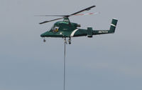 N674TH @ O69 - Timberline Helicopters (Sand Point, ID) 2004 Kaman K-1200 K-MAX hovering for landing at Petaluma Municipal Airport, CA temporary home base after making water drops on the devastating October 2017 Northern California wild fires