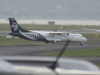 ZK-MVQ @ NZAA - newish to fleet and new to me - hence long range fuzzy photo from car park in high wind! - by magnaman