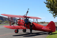 N68405 @ SZP - 1943 Boeing Stearman A75N1 (PY-17), Pratt & Whitney R985 450 Hp radial upgrade, external air filter, Restricted class, wing-rider equipped, climbing aloft - by Doug Robertson