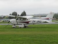ZK-JRG @ NZAR - on grass at flying club - by magnaman