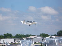 N9943H @ OSH - Cirrus Jet on takeoff - by Christian Maurer